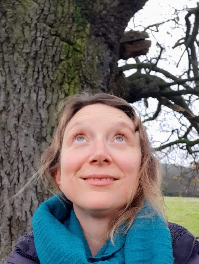 Nichola Scholfield looks up at trees